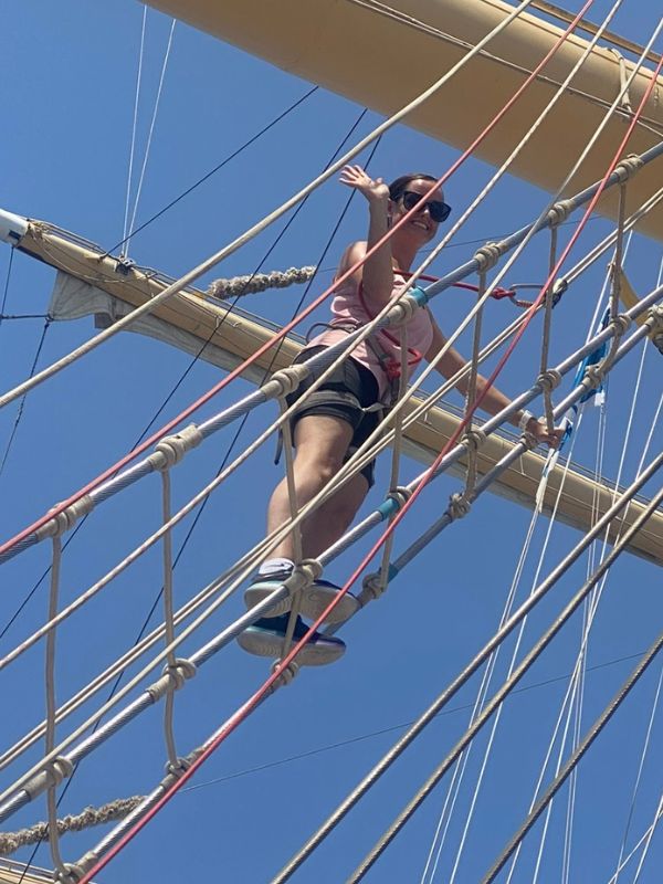 Me climbing the mast