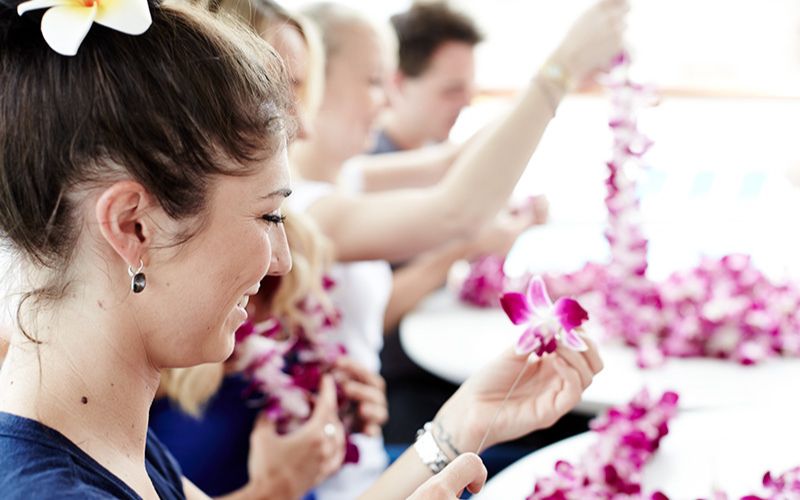 woman making a lei