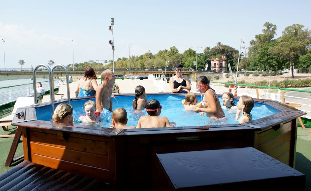 Croisi Europe pool with kids and adults enjoying their holiday