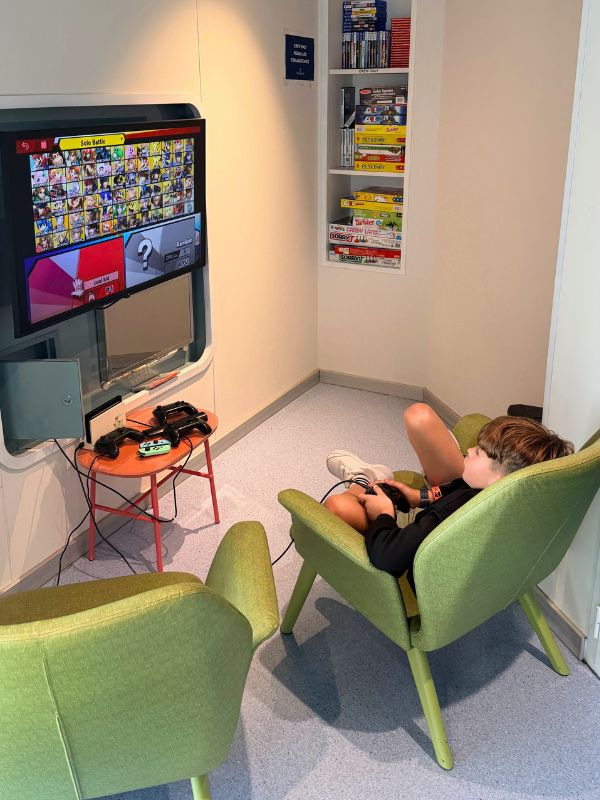 Adam playing video games in his chair