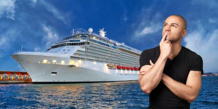 A man in a black shirt stands thoughtfully with his hand on his chin in front of a large, brightly lit cruise ship docked at a port during twilight. The sky is partly cloudy, adding a dramatic backdrop to the scene.