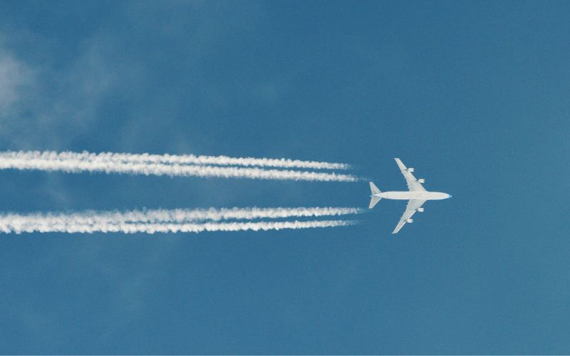Airplane with plane trails