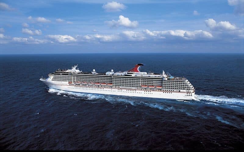 Massive carnival spirit, gliding through the open sea.