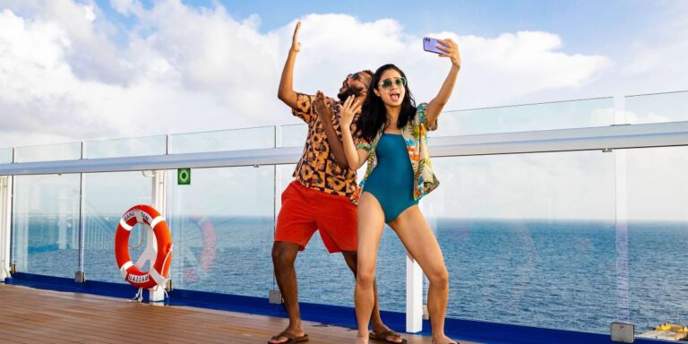 Carnival Couple Using Phone