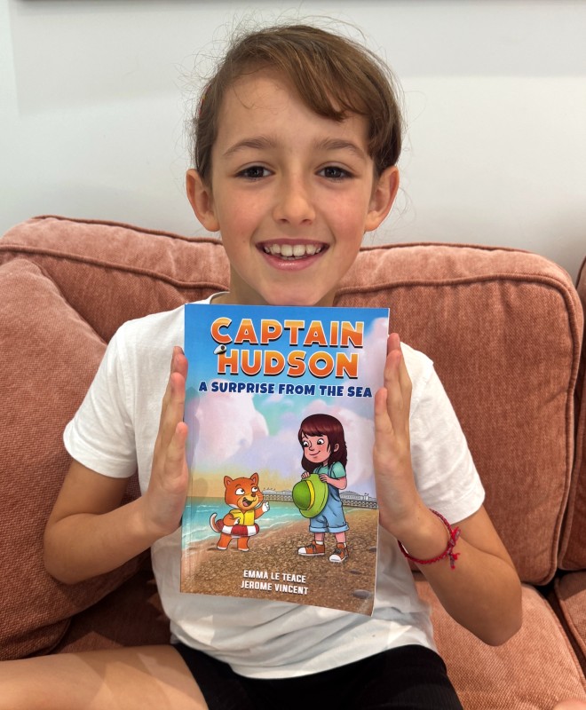 Leonie with Captain Hudson book