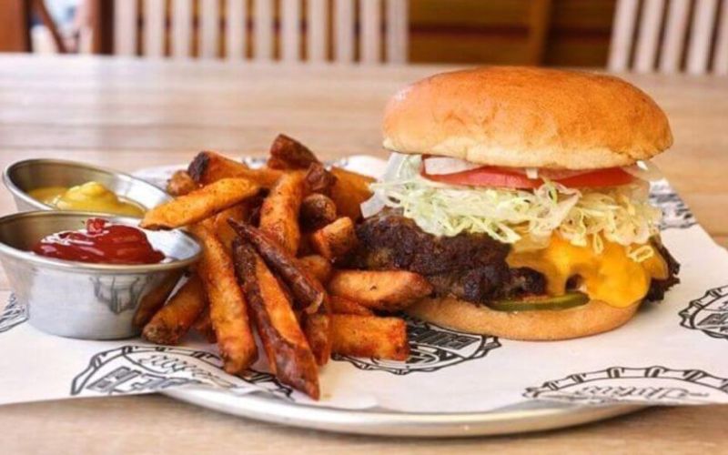 Appetizing chips and burger meal served on carnival cruise ships