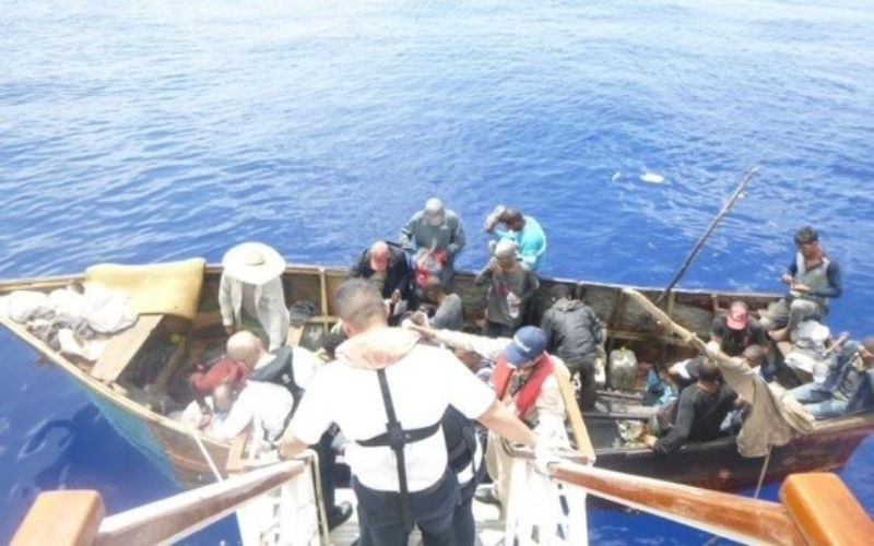 people rescued on a small boat by Carnival Paradise