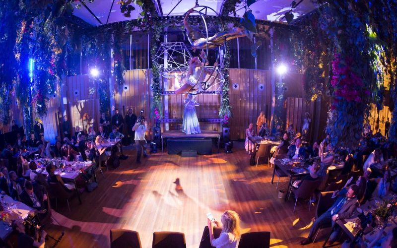 An indoor performance by the entertainers of celebrity cruises