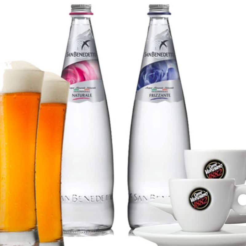 A promotional image contrasting a glass of beer with a rich head of foam against two bottles of San Benedetto water, one "Naturale" and one "Frizzante", flanked by coffee cups with the "Vergnano 1882" logo, representing a variety of beverage options.