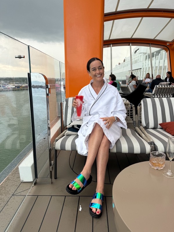 Me wearing a robe on the magic carpet on Celebrity Apex