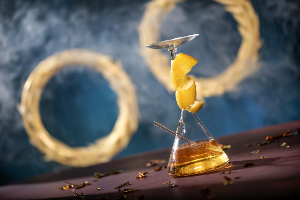 Circle of the Cosmos – Brunswick Aces Diamonds Gin, verjus blanc, and fresh lemon juice garnished with a lemon peel spiral