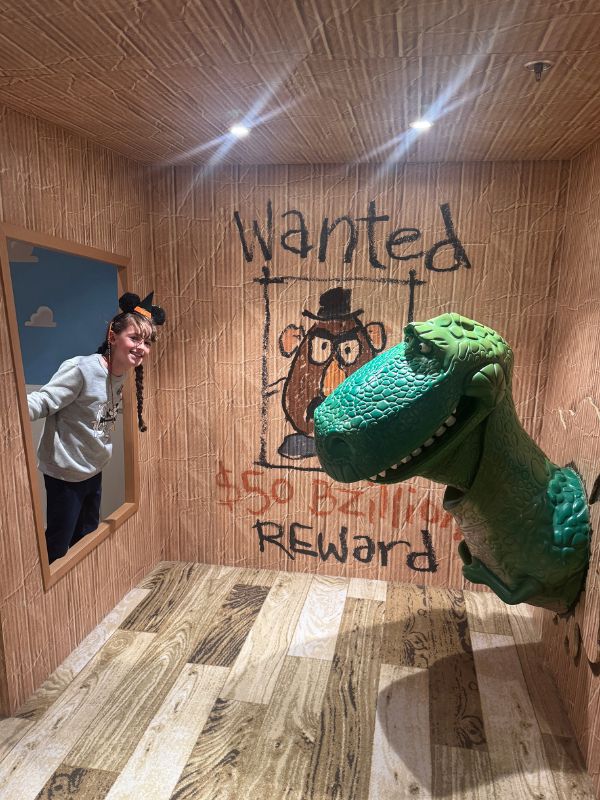 Girl and Dinosaur from Toy Story on a Disney Cruise