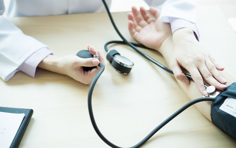 Doctor taking blood pressure