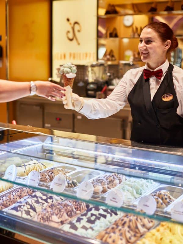 A lady serving ice cream on an MSC cruise ship.