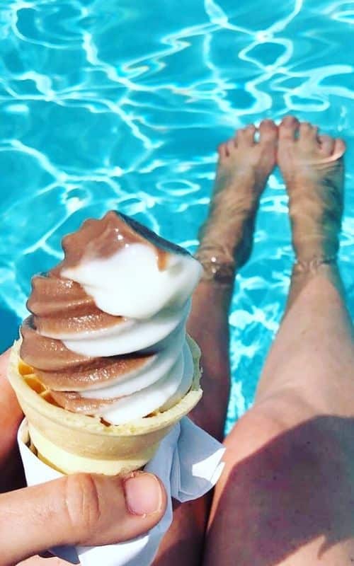 Eating ice cream while in the pool