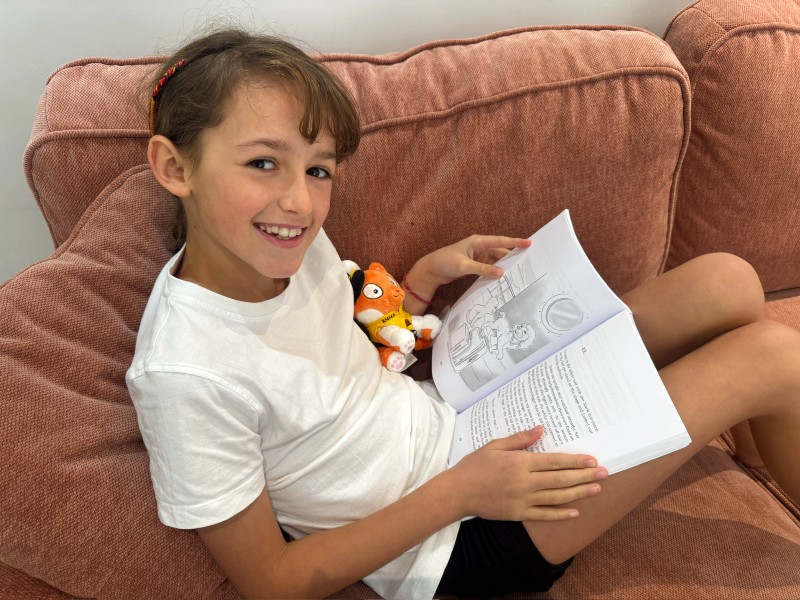 Leonie reading Emma Cruises's book