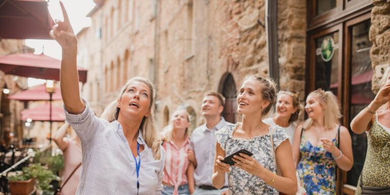 A group of people being showed around on a city tour.
