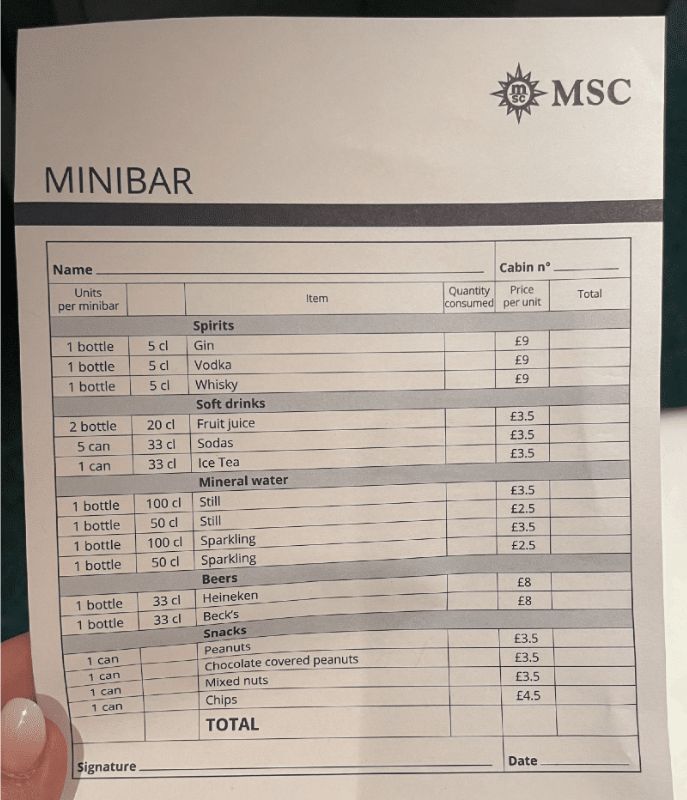 A minibar price list from MSC Cruises displays various items and their prices. Spirits include gin, vodka, and whisky at £9 each. Soft drinks like fruit juice, sodas, and ice tea are priced at £3.5 each. Mineral water ranges from £2.5 to £3.5, and beers such as Heineken and Beck's cost £8 each. Snacks, including peanuts, chocolate-covered peanuts, mixed nuts, and chips, are priced between £3.5 and £4.5. The form includes spaces for cabin number, quantity consumed, and total cost.