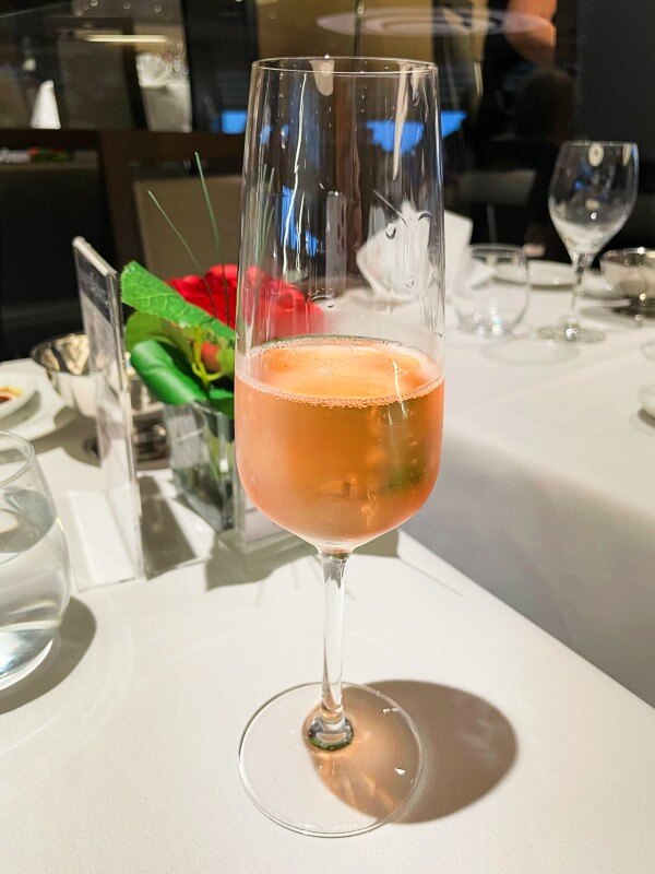 Glass of sparkling rose in MSC Cruises dining room 