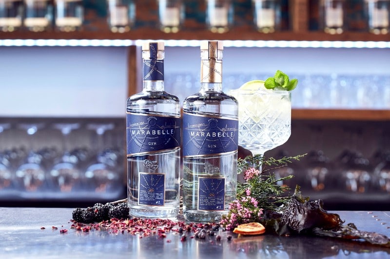 Two bottles and a glass of P&O's Marabelle Gin