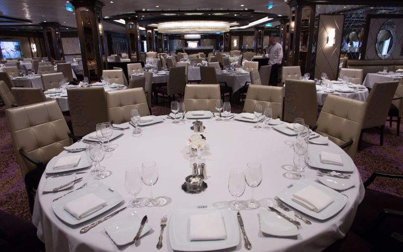 A beautiful round table with chairs for a group of guests