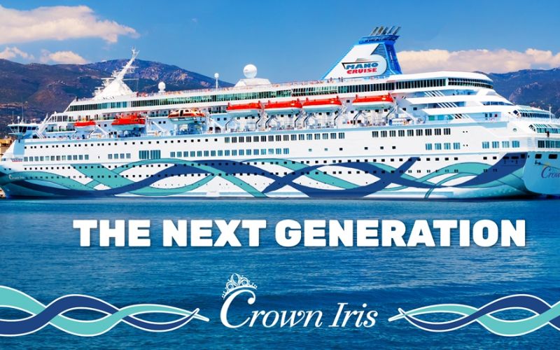 Promotional image of the Crown Iris cruise ship, labeled 'THE NEXT GENERATION' with a backdrop of clear blue skies and mountains, symbolizing the newest addition to the Mano Cruise fleet.