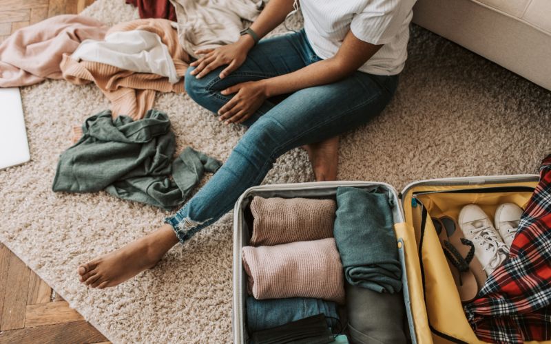 A cruise ship passenger packing her luggage,