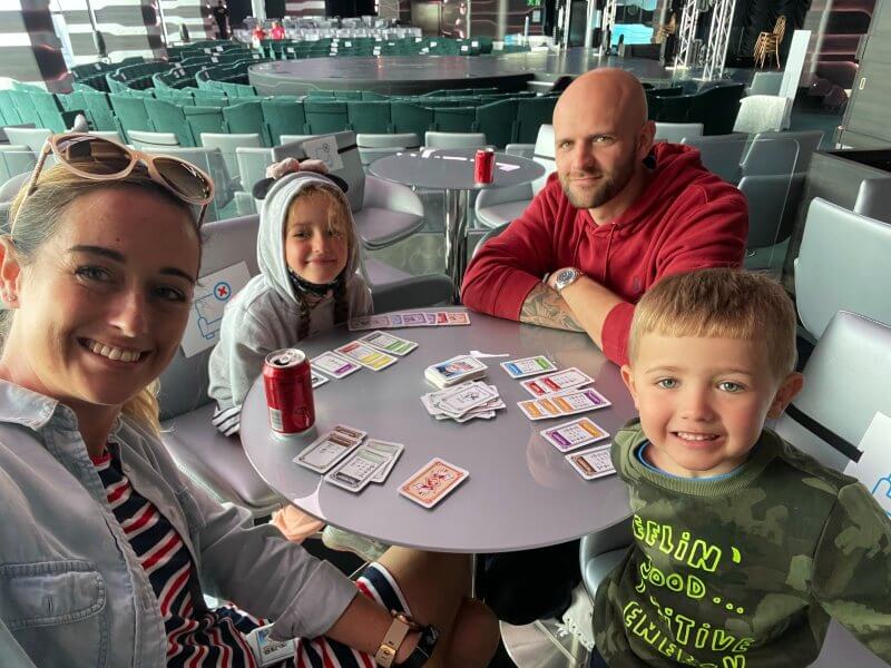 My family paying Monopoly Deal on an MSC cruise