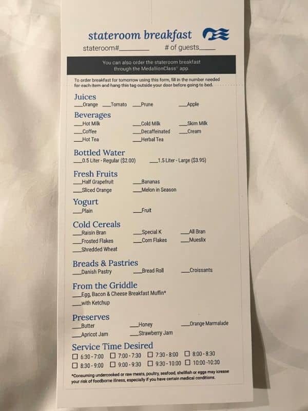 A stateroom breakfast order form on a Princess cruise ship listing options such as juices (orange, tomato, prune, apple), beverages (hot milk, cold milk, skim milk, coffee, decaffeinated coffee, tea, herbal tea), bottled water, fresh fruits, yogurt, cold cereals, breads and pastries, items from the griddle, and preserves. The form includes checkboxes for selecting desired service time.