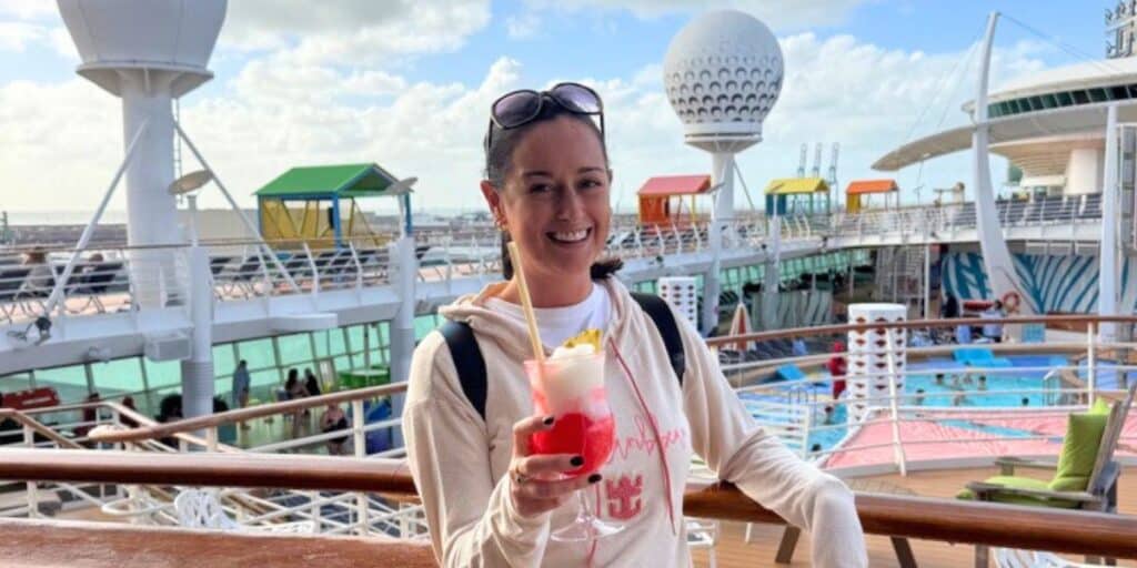 Cruise Mummy wearing a Royal Caribbean hoody on the pool deck of Independence of the Seas
