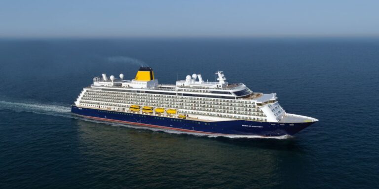 A large cruise ship, Saga Spirit of Discovery, sailing in the ocean.