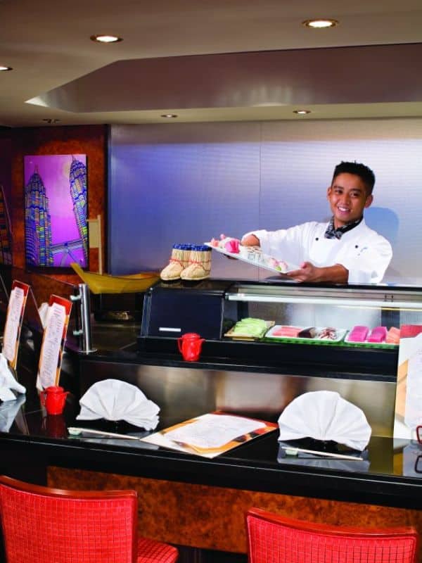 Chef serving sushi on an NCL Cruise