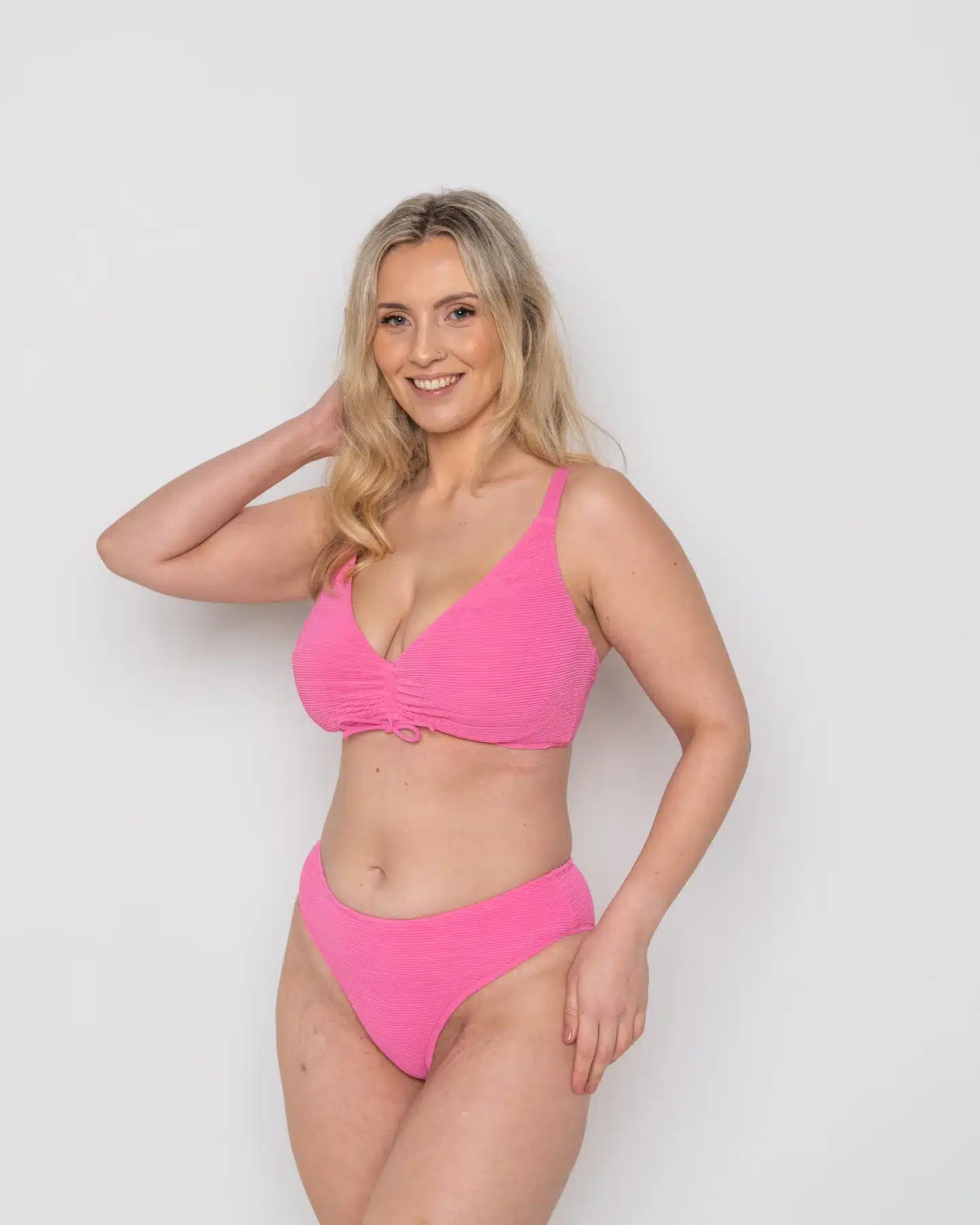 Ivory Rose model wearing pink bikini