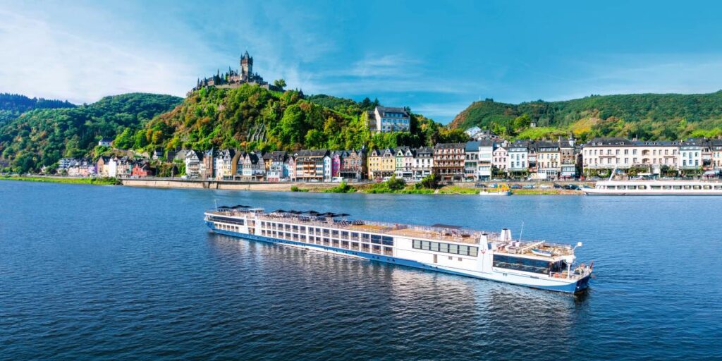 TUI ship sailing past Cochem on the Rhine