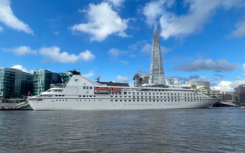 Wind star resting in a port under a clear, bright sky