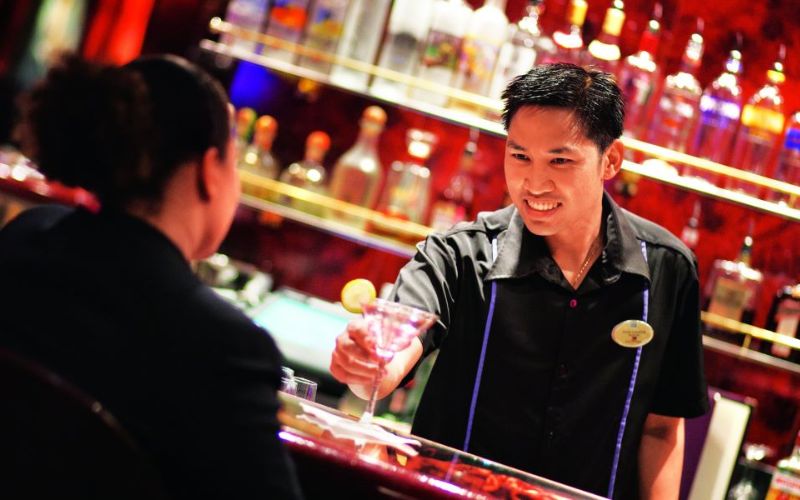 Bartender handing out a drink