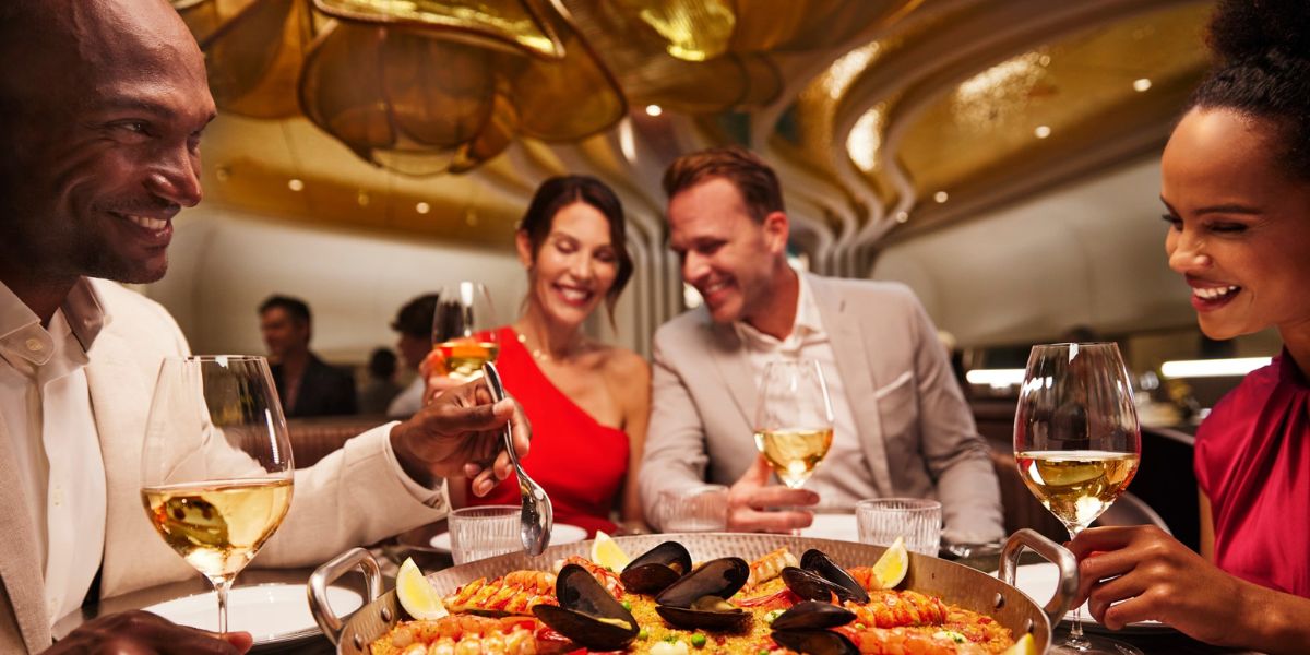 2 couples having a fun time at a elegant-looking dinner double date on a cruise