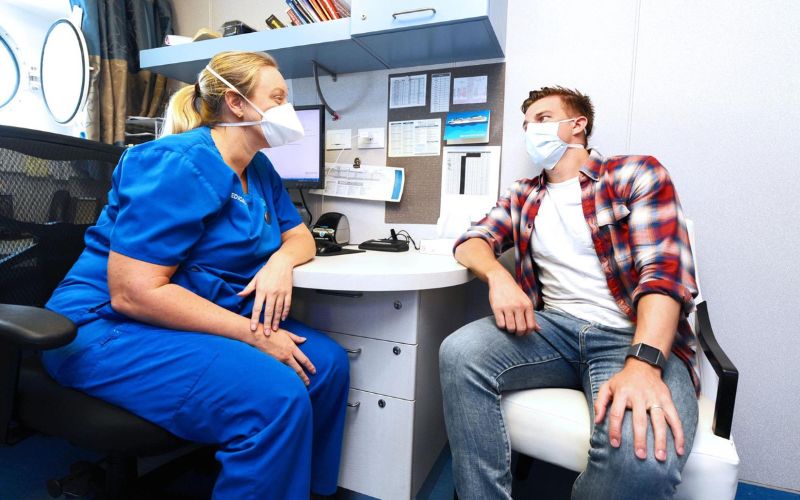 Doctor and patient talking on a cruise