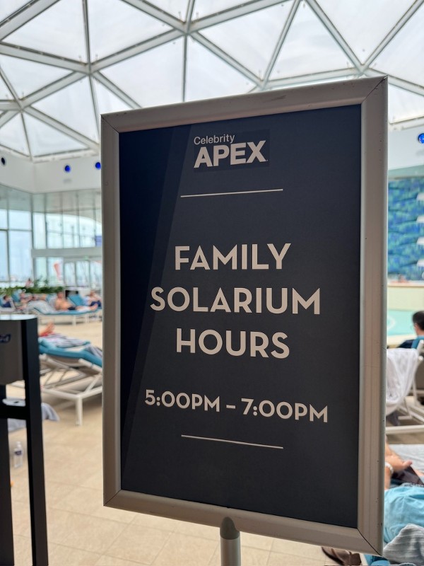 Celebrity Apex Solarium family hours sign.