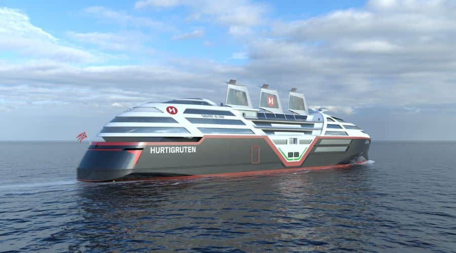 A modern Hurtigruten cruise ship cruising on calm sea waters under a partly cloudy sky. The ship is sleek and futuristic in design, featuring a dark grey and red hull with multiple solar panels on its top deck, showcasing its eco-friendly propulsion technology.