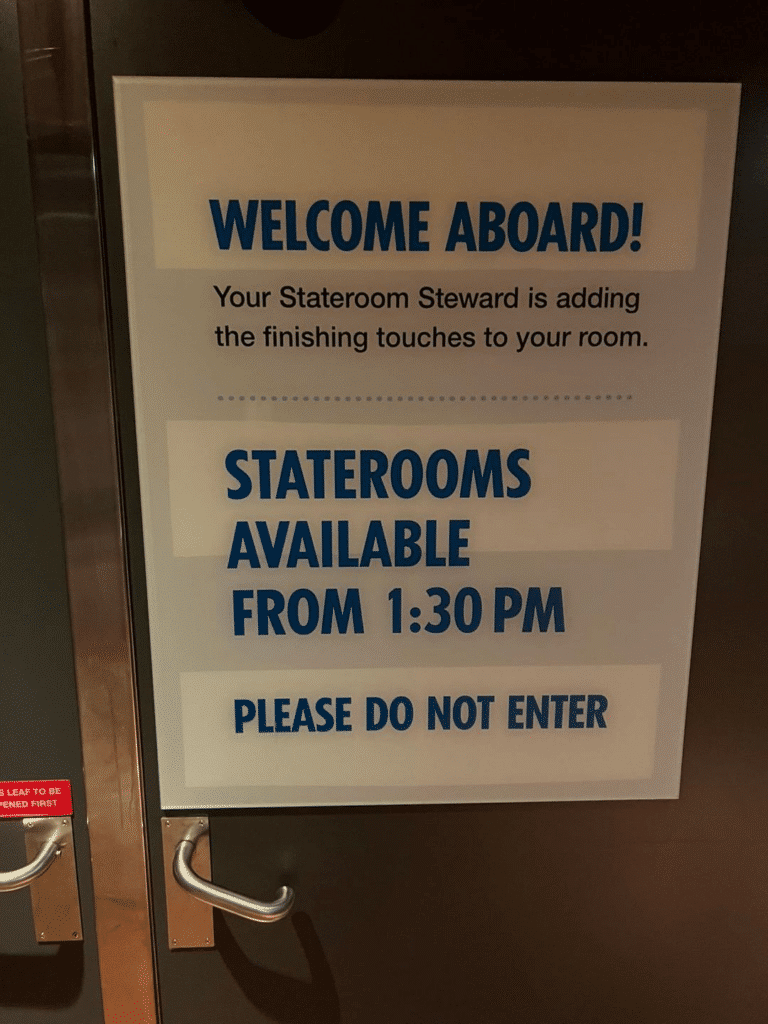 Welcome aboard sign on a Carnival cruise ship showing when staterooms will be ready.