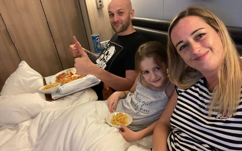 Family having snacks while in bed