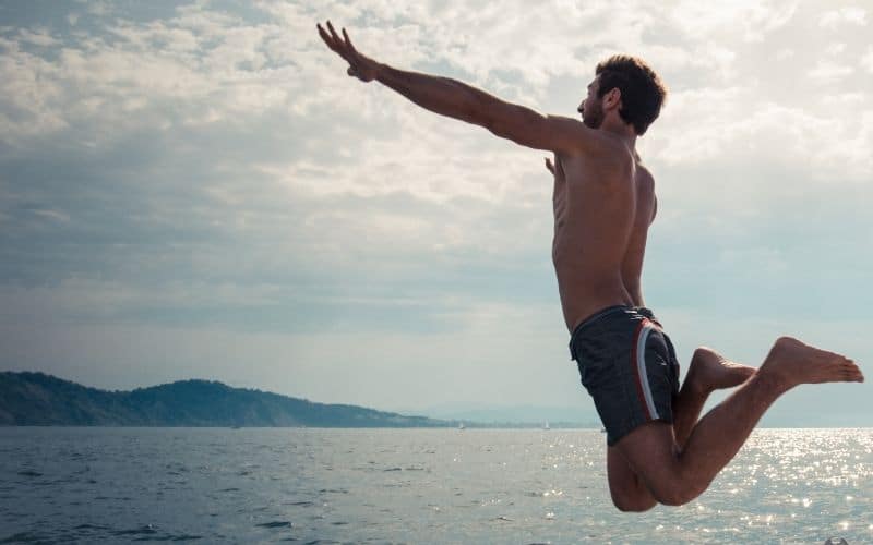 man jumping off cruise ship