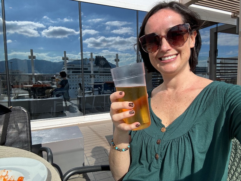 Jenni with a beer on Costa