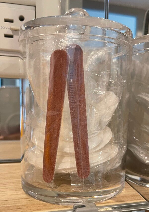 Nail files and cotton wool pads in jar