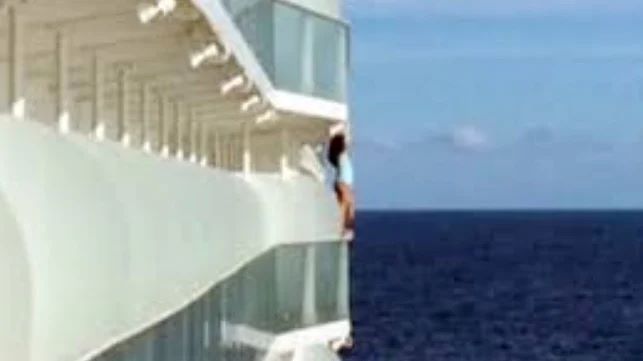 woman climbing over cruise ship balcony