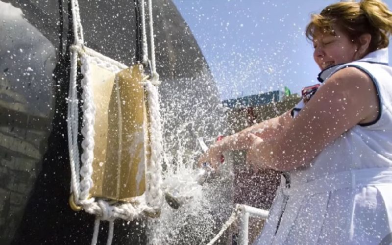 smashing a champagne bottle