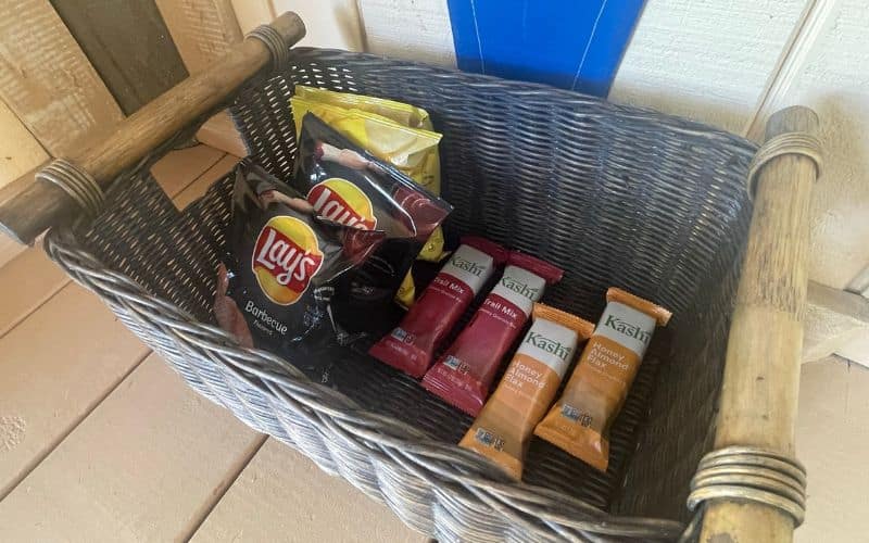 Lays crisps and granola bars inside the basket