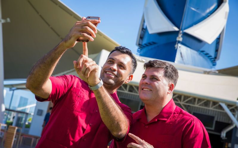 Two gentlemen taking a selfie onboard