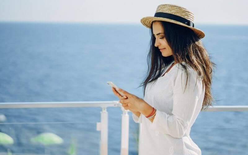 Cruise guest using their phone on WiFi